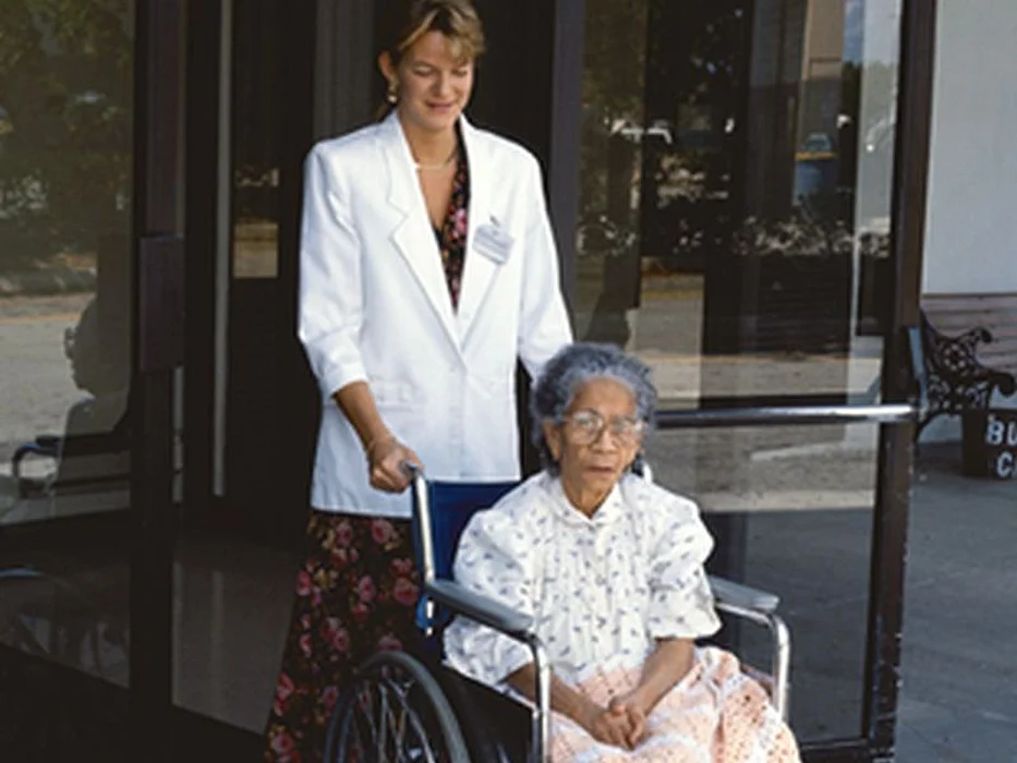 elderly woman in wheelchair