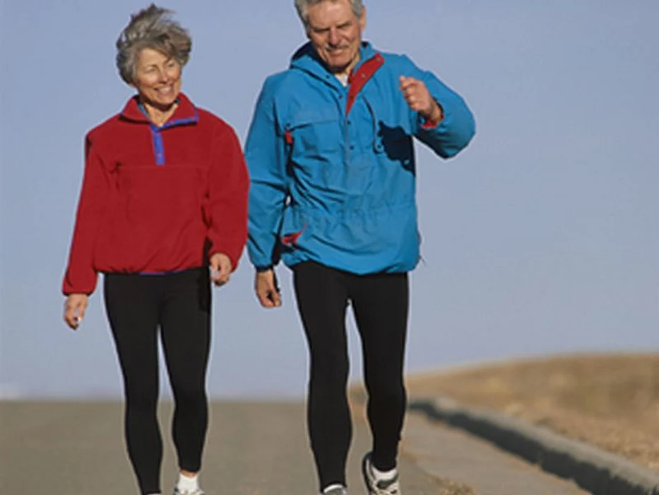 elderly couple walking