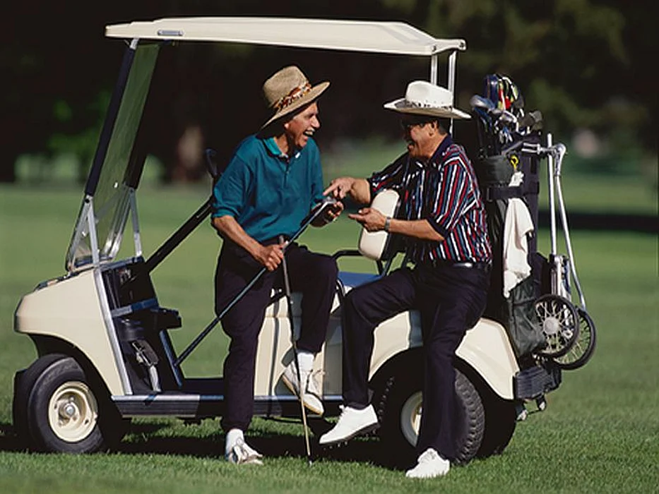 men on a golf cart