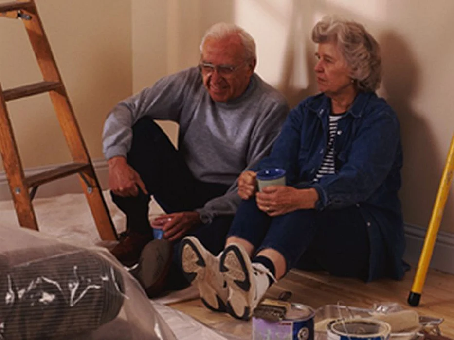elderly couple painting