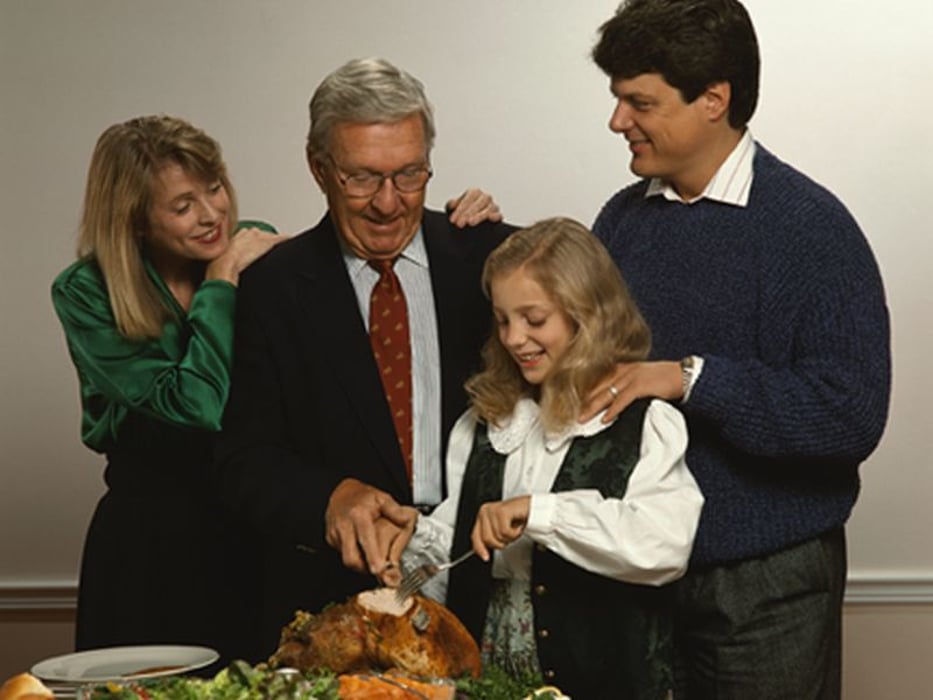 family eating turkey