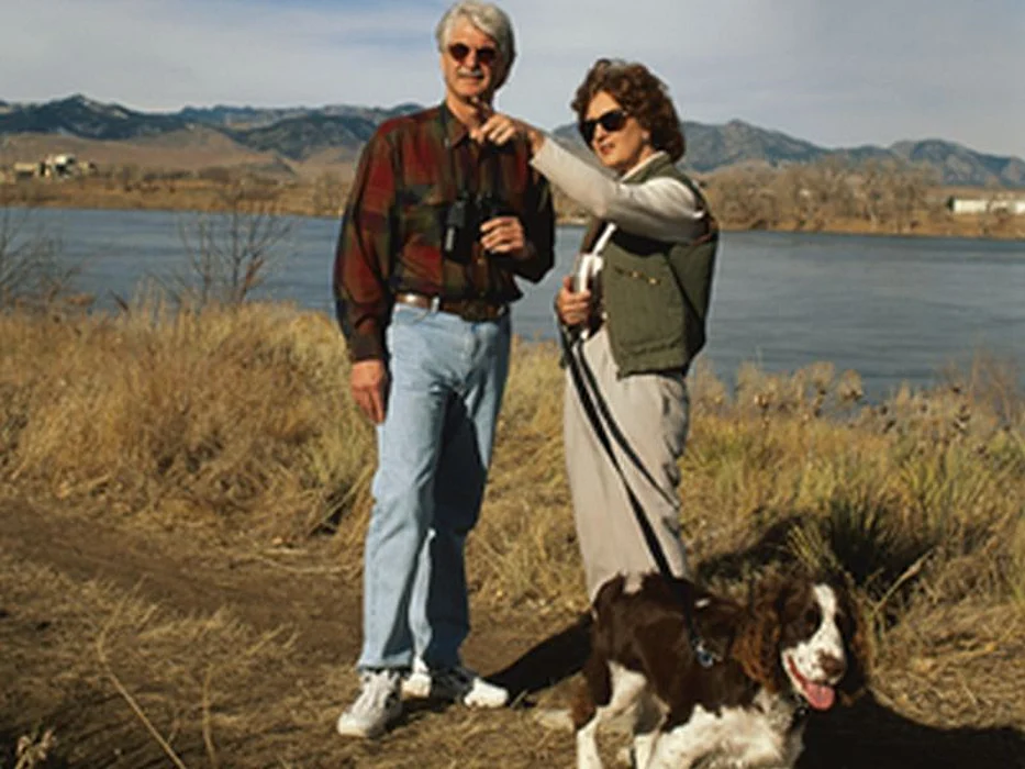 couple walking dog