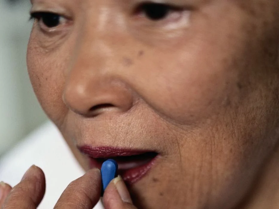 Woman taking a pill