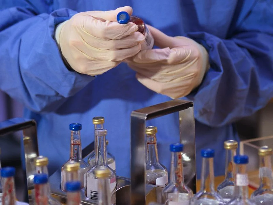 technician working with laboratory specimen