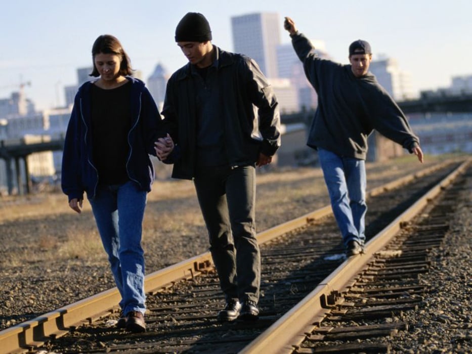teens on a train tracks