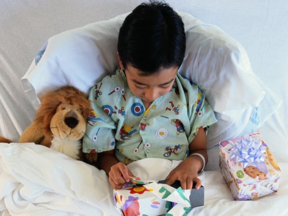 a boy on a hospital bed