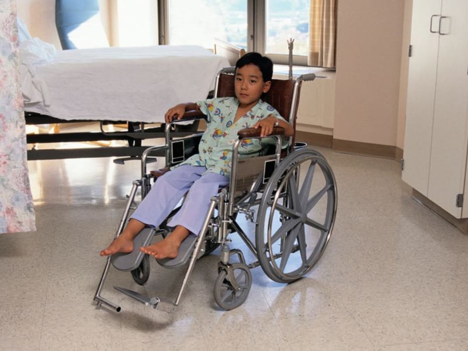 a child on a wheelchair
