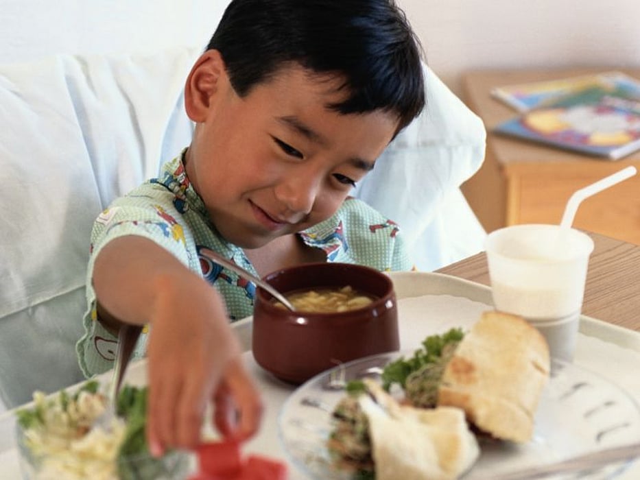 a child eating hospital food