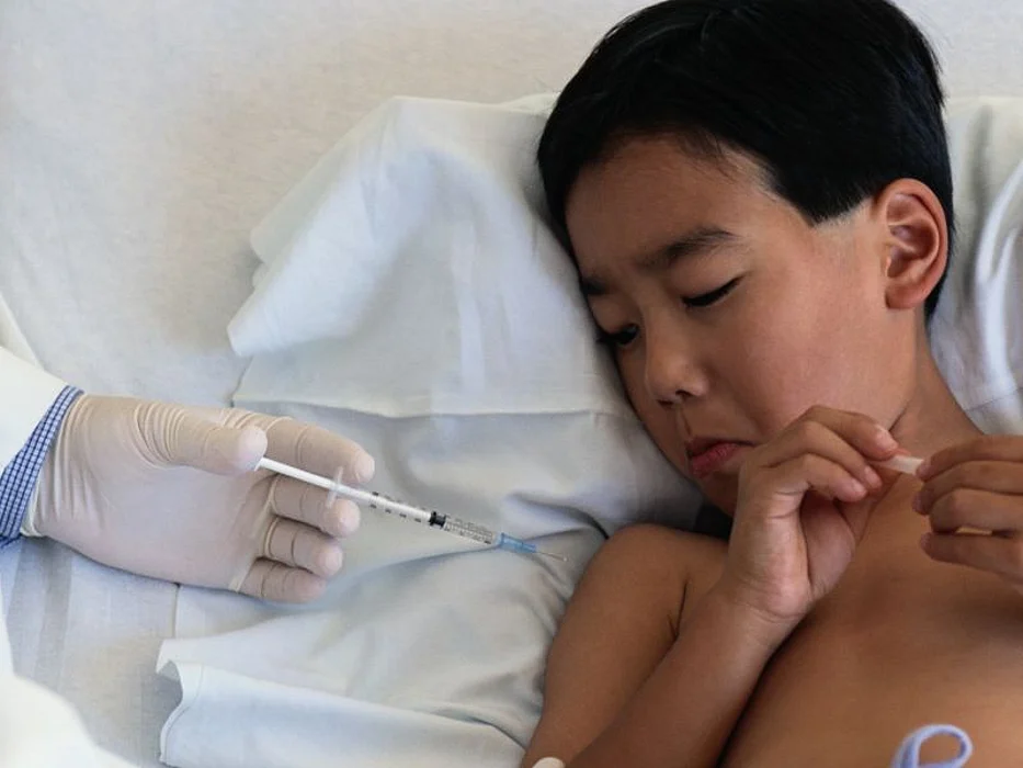 a boy getting vaccine