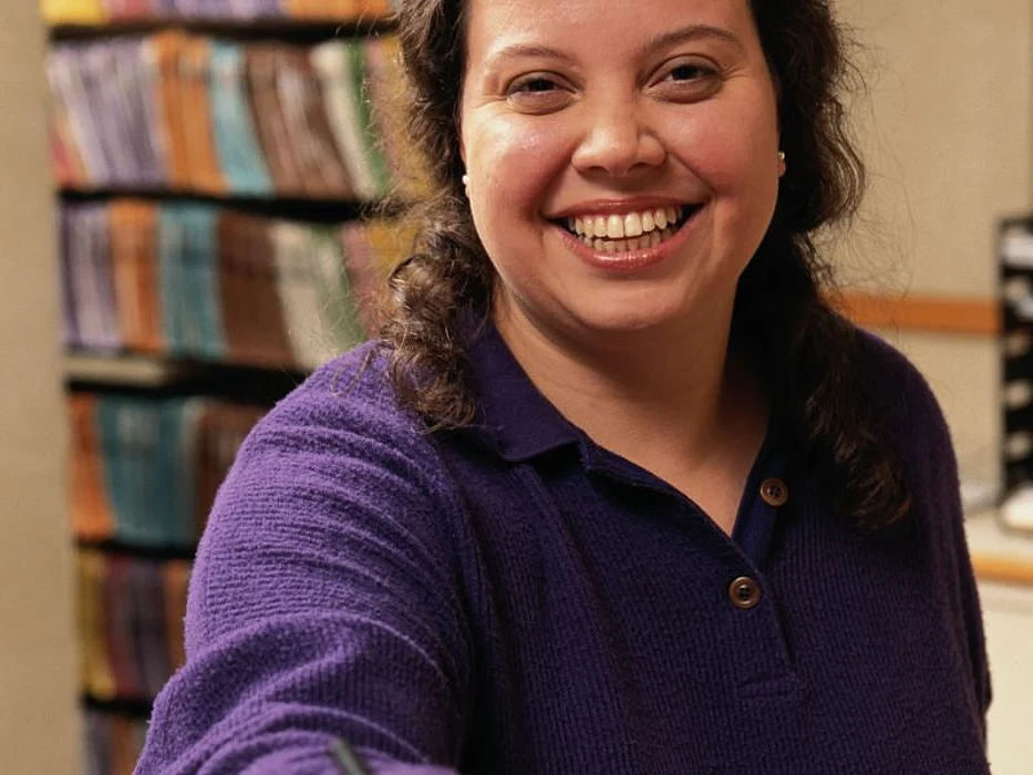 woman with a files behind her