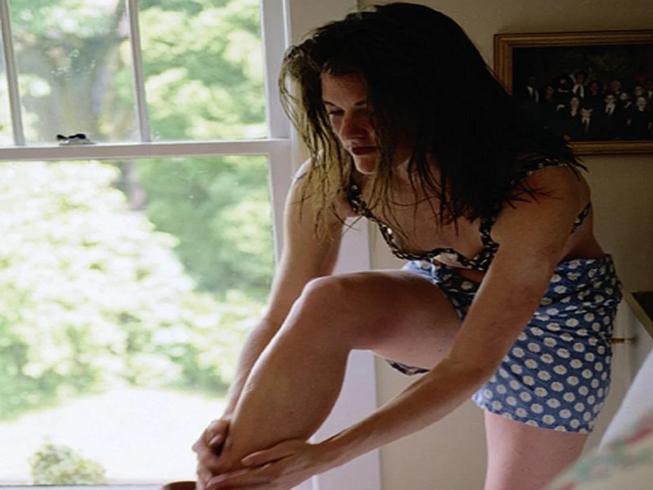 woman massaging leg