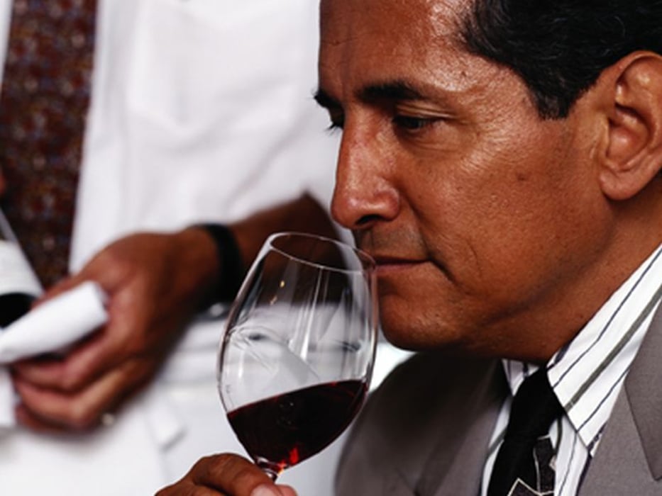 man tasting the wine