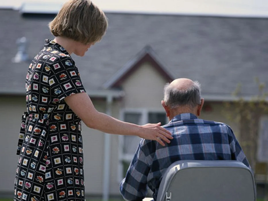 elderly man and caretaker