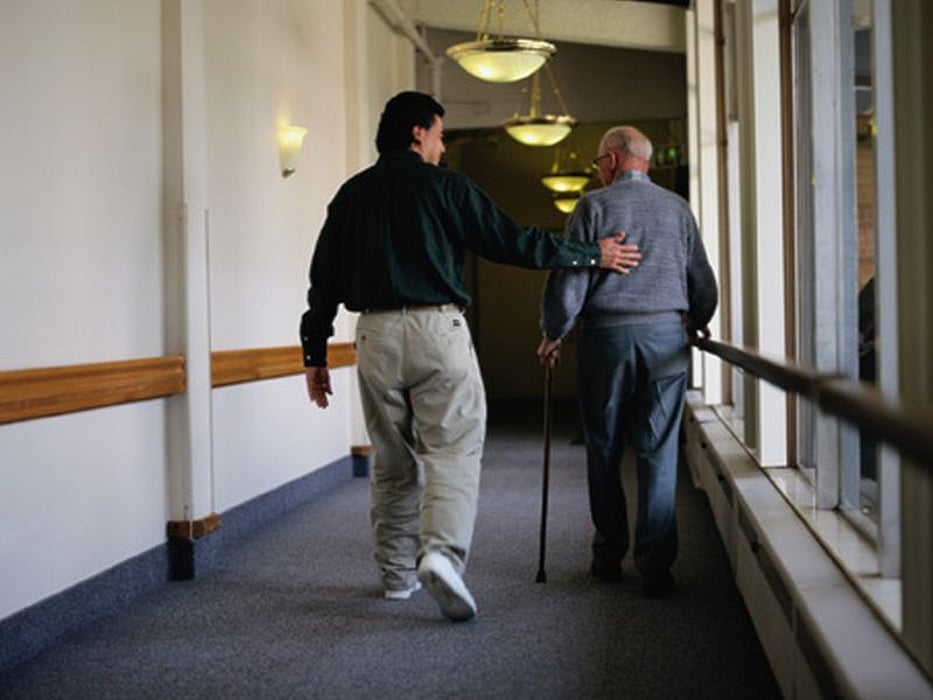 elderly man and caretaker