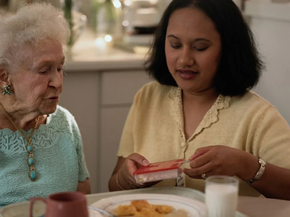 elderly woman and caregiver