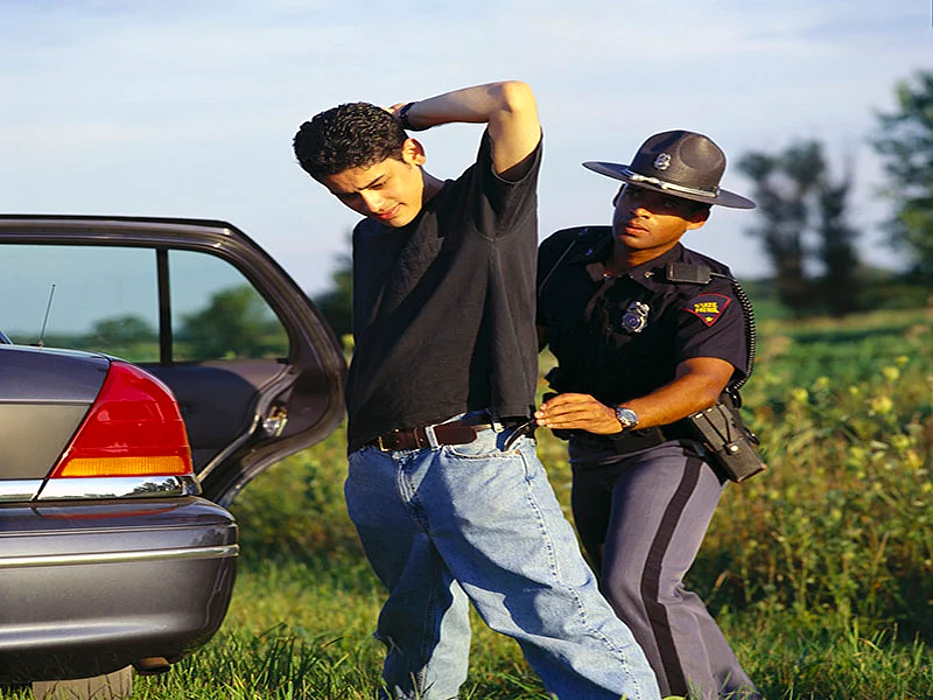 police officer arresting a driver
