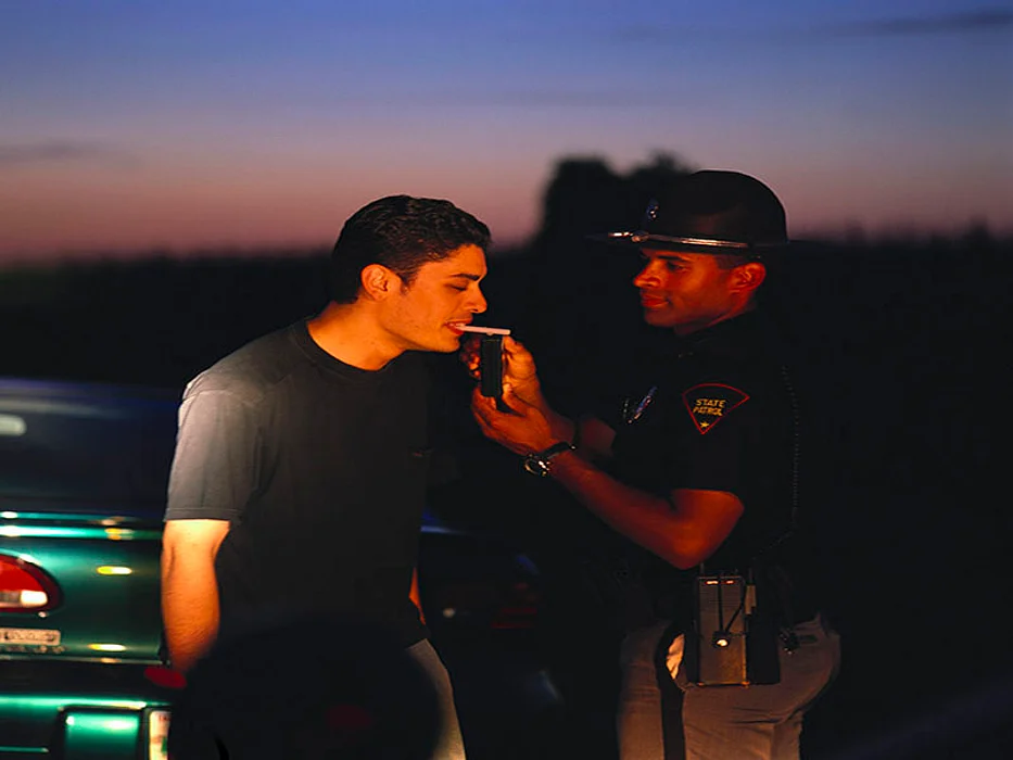 police officer checking for a drunk driving