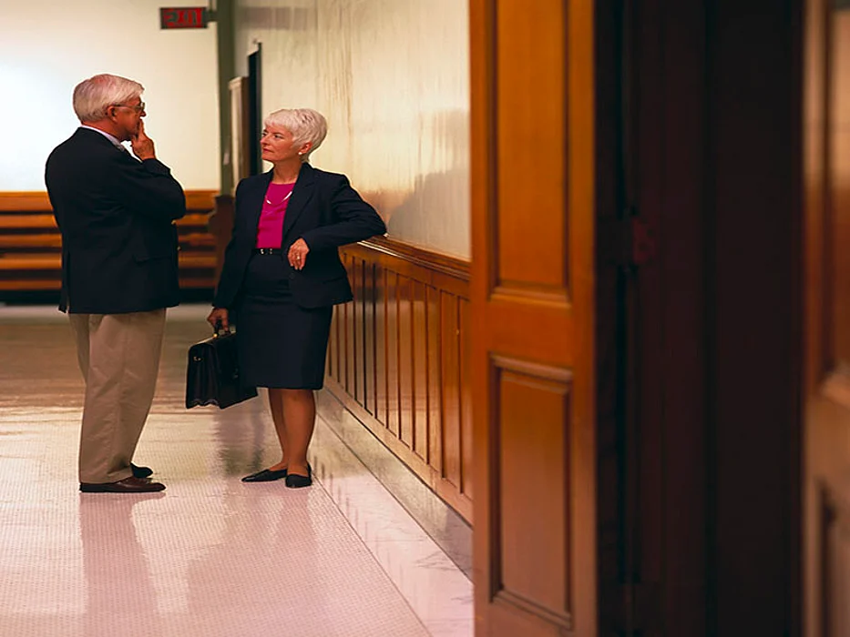 lawyers talking in the court hallway
