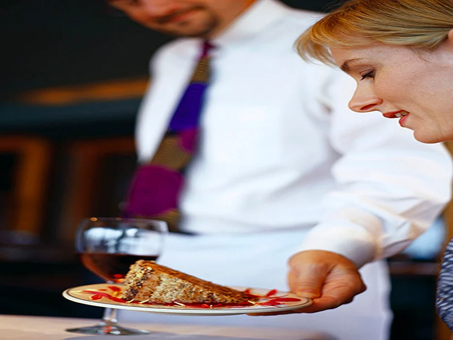 waiter serving food in the restaurant
