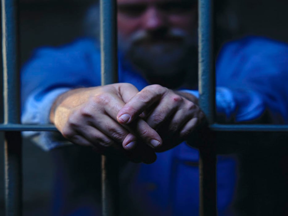 prisoner behind the bars