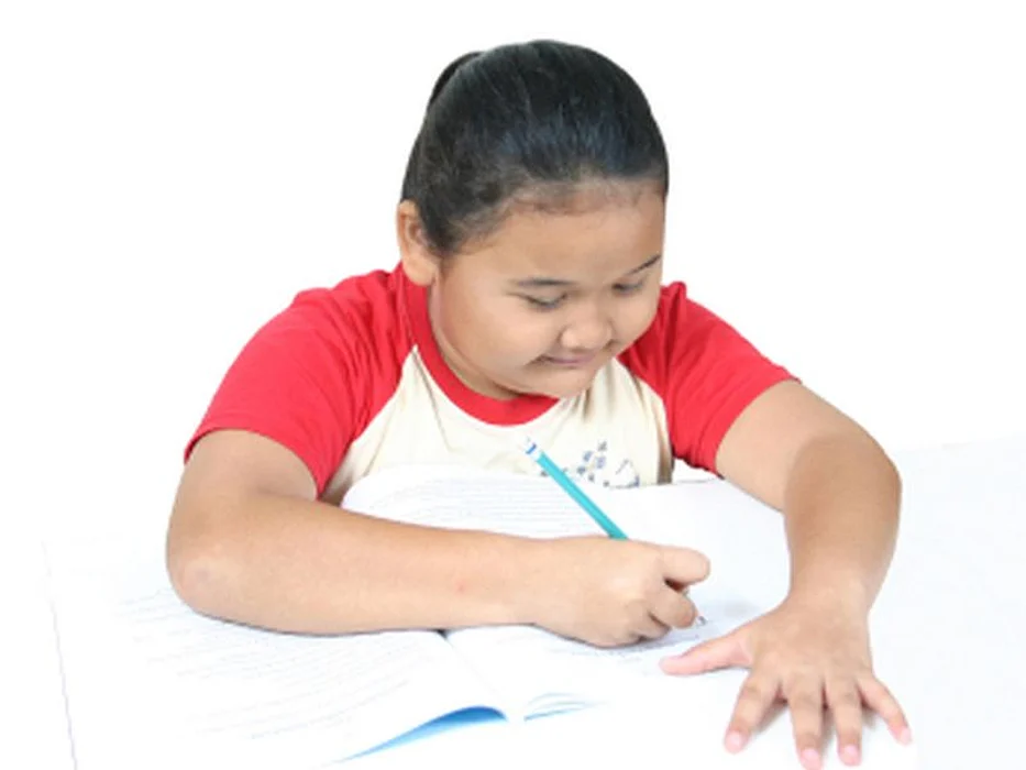 fat child writing something