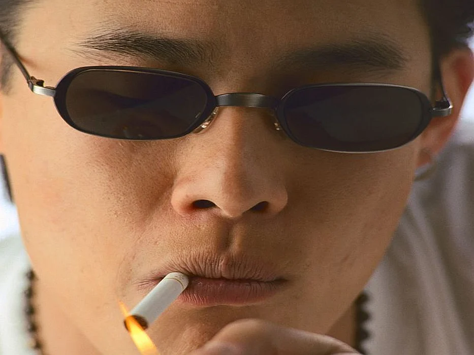 man smoking a cigarette