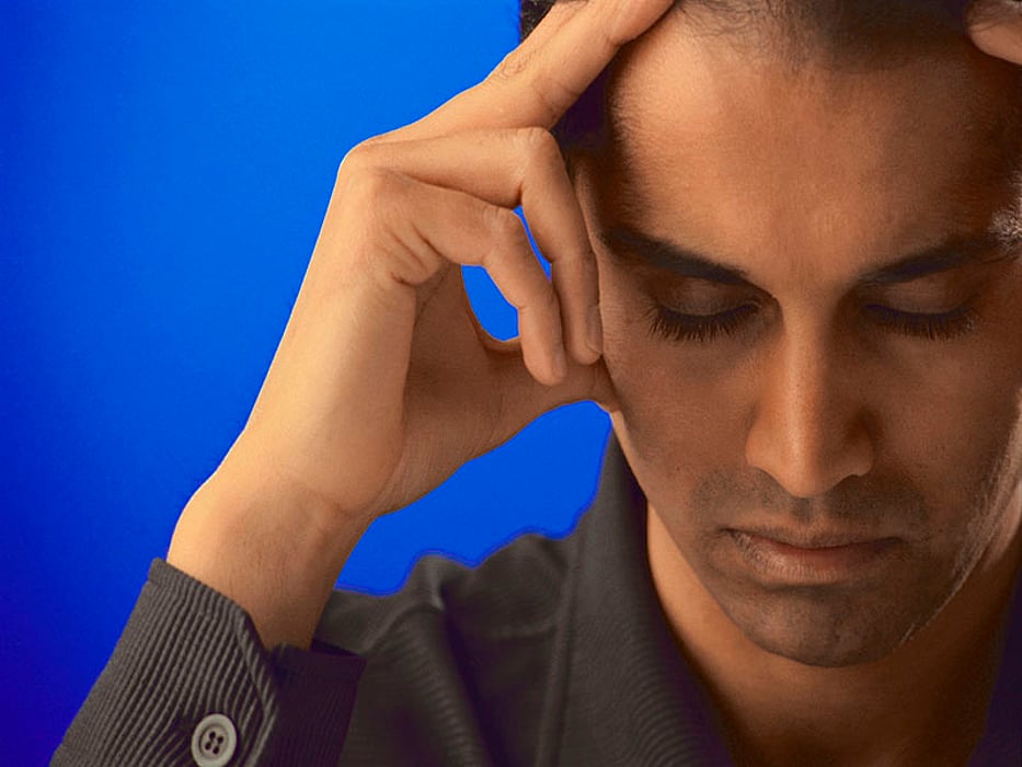 man holding his head