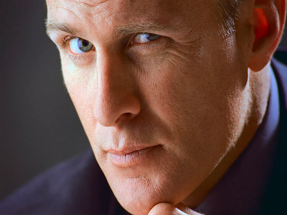 man\'s face looking with suspicion
