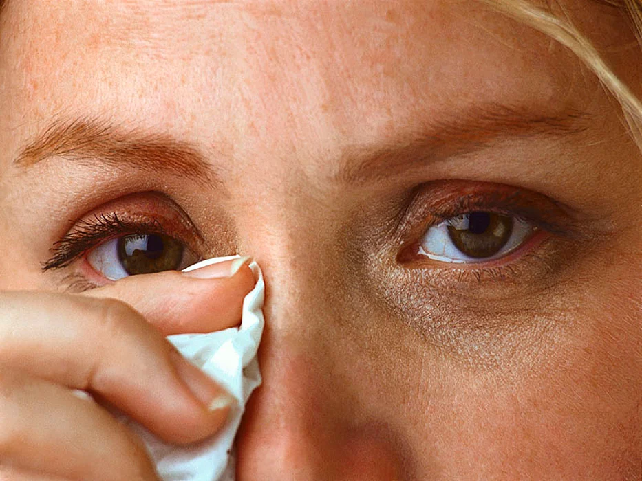 woman wiping tears