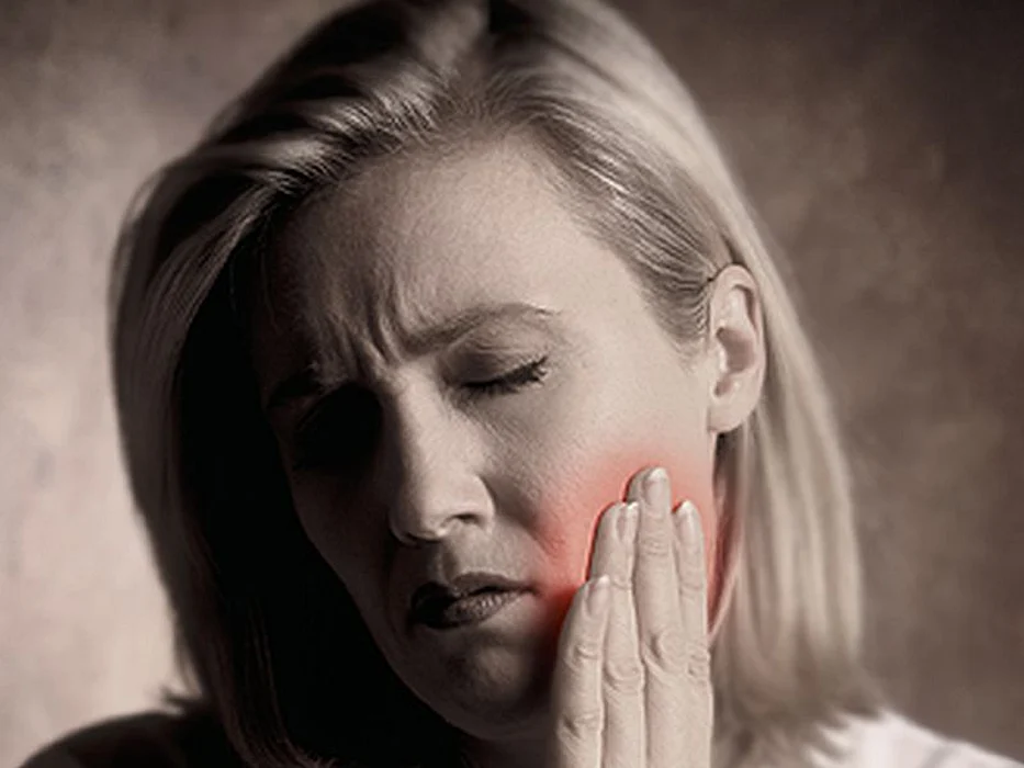 woman with cheek pain