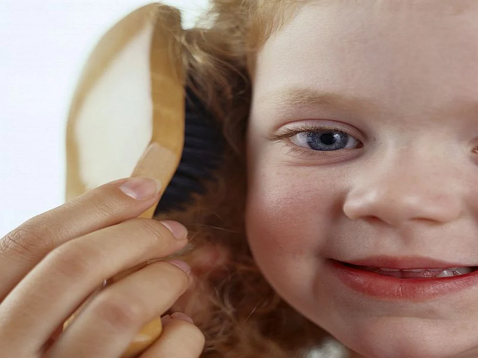 girl brushing her hair
