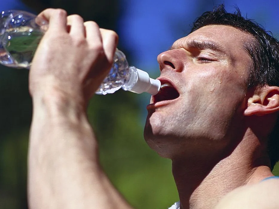 man drinking water