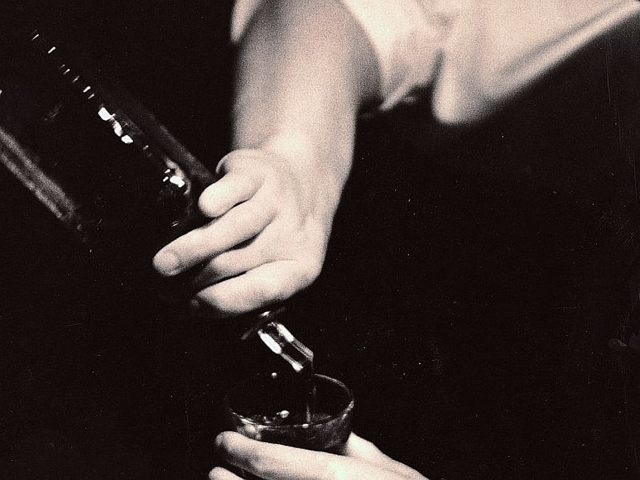 pouring alcohol into a glass