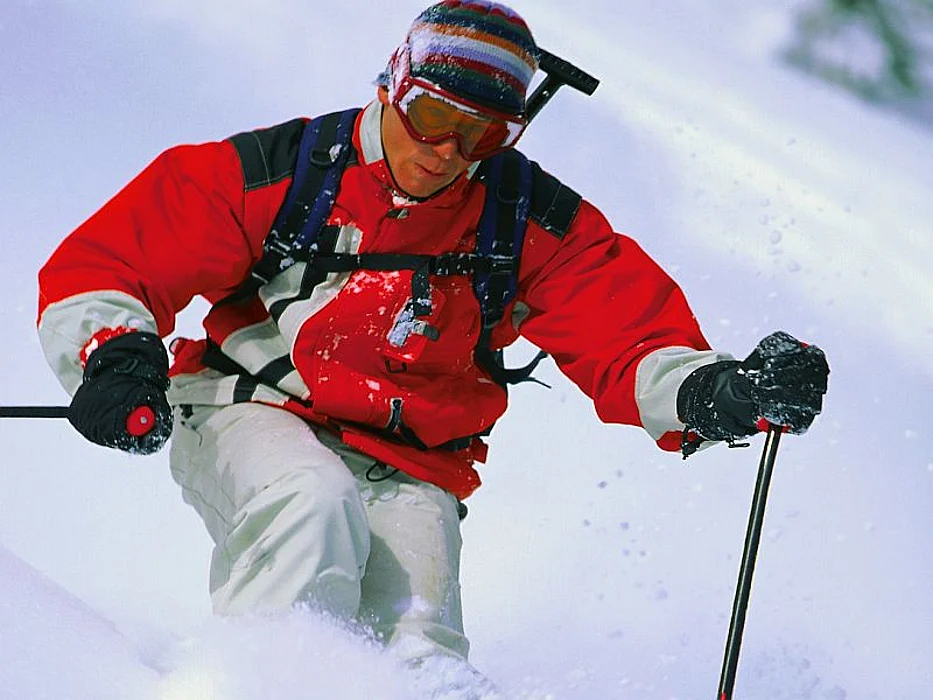 man downhill skiing
