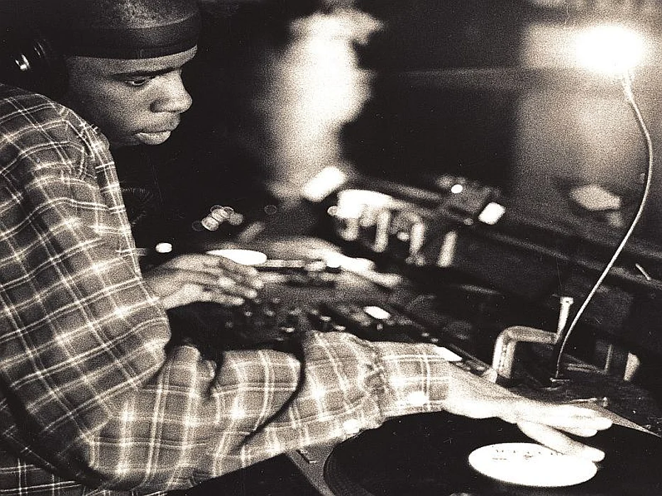man DJ behind console
