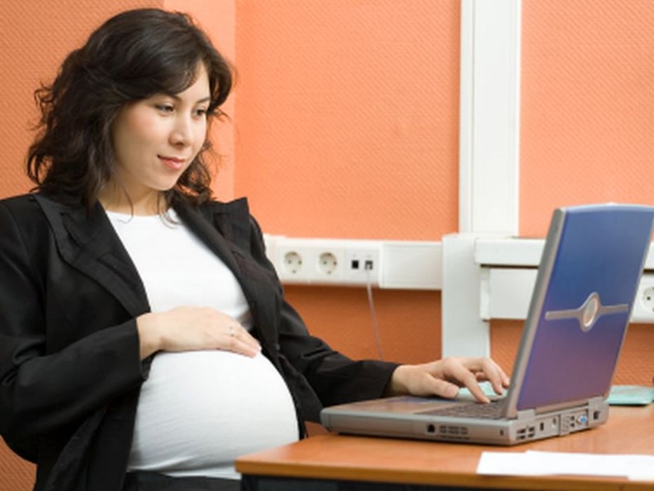 pregnant woman using computer