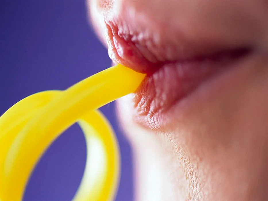 woman sipping liquid
