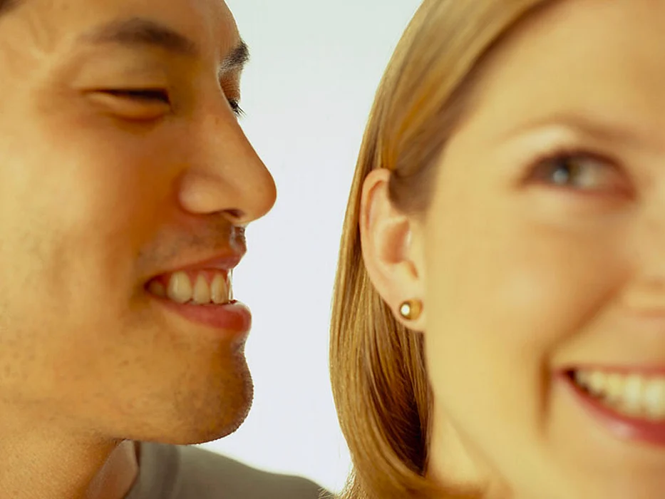 man and woman smiling