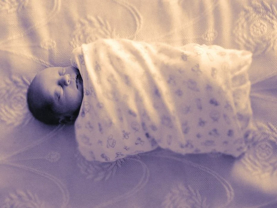 infant in blanket