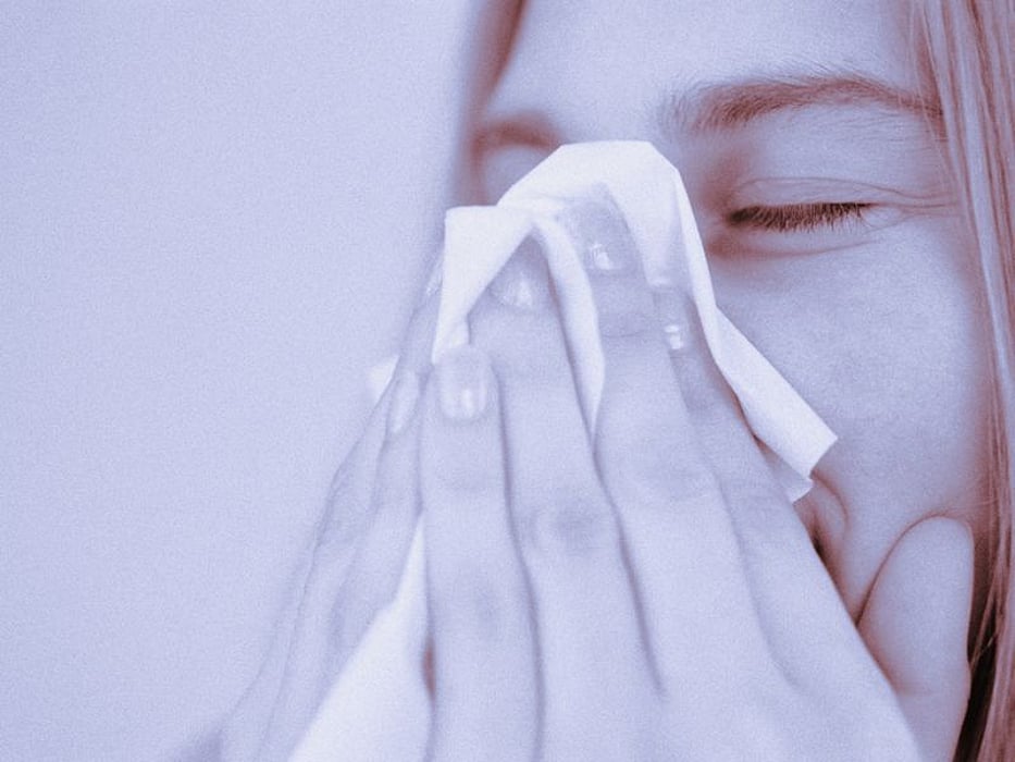sneezing into tissue