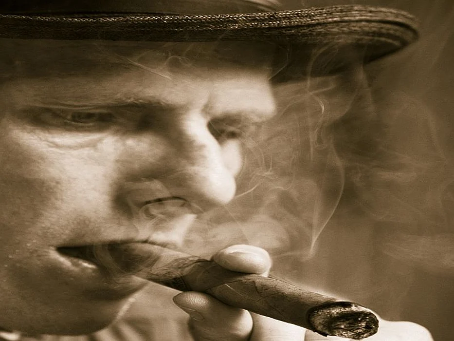 man smoking a cigar