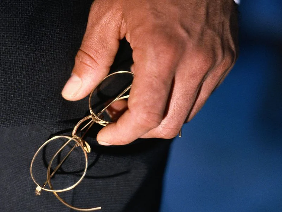 man holding glasses