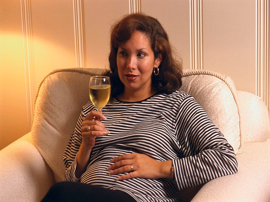 pregnant woman drinking wine