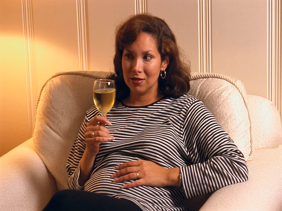 pregnant woman drinking wine