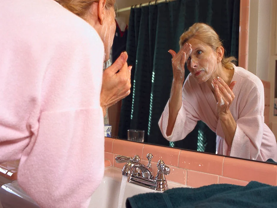 woman washing face
