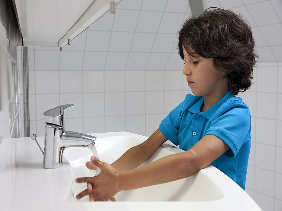 boy washing his hands