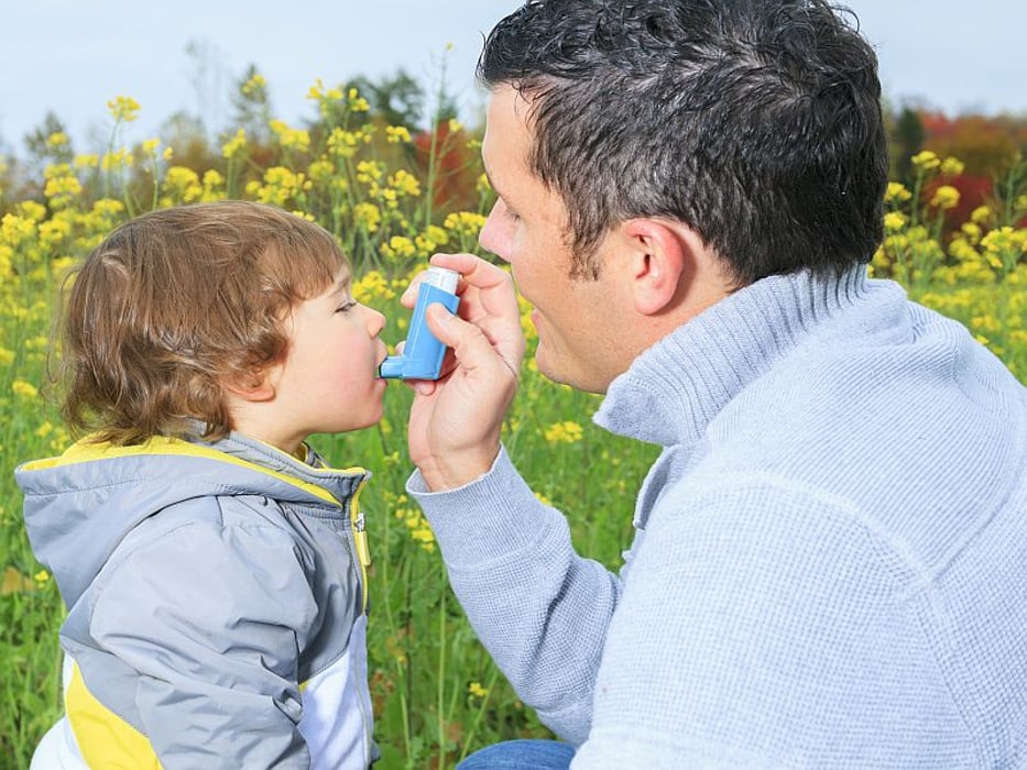 child with asthma inhaler