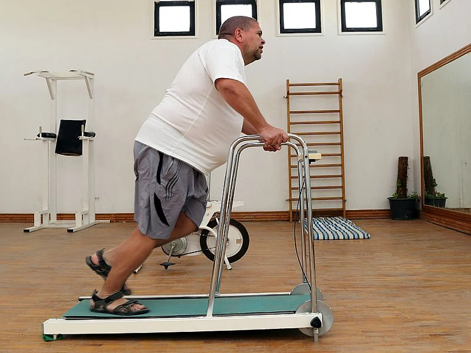overweight man on treadmill