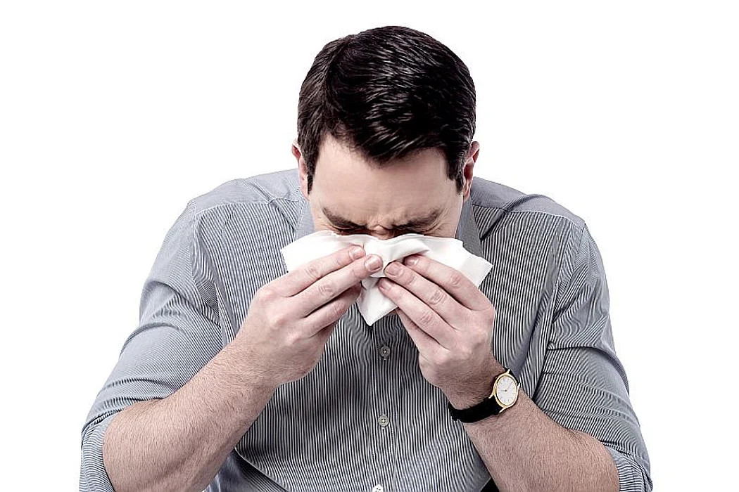 man sneezing