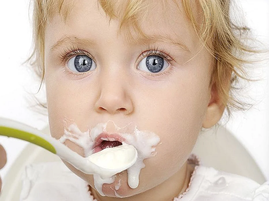 baby eating cereal